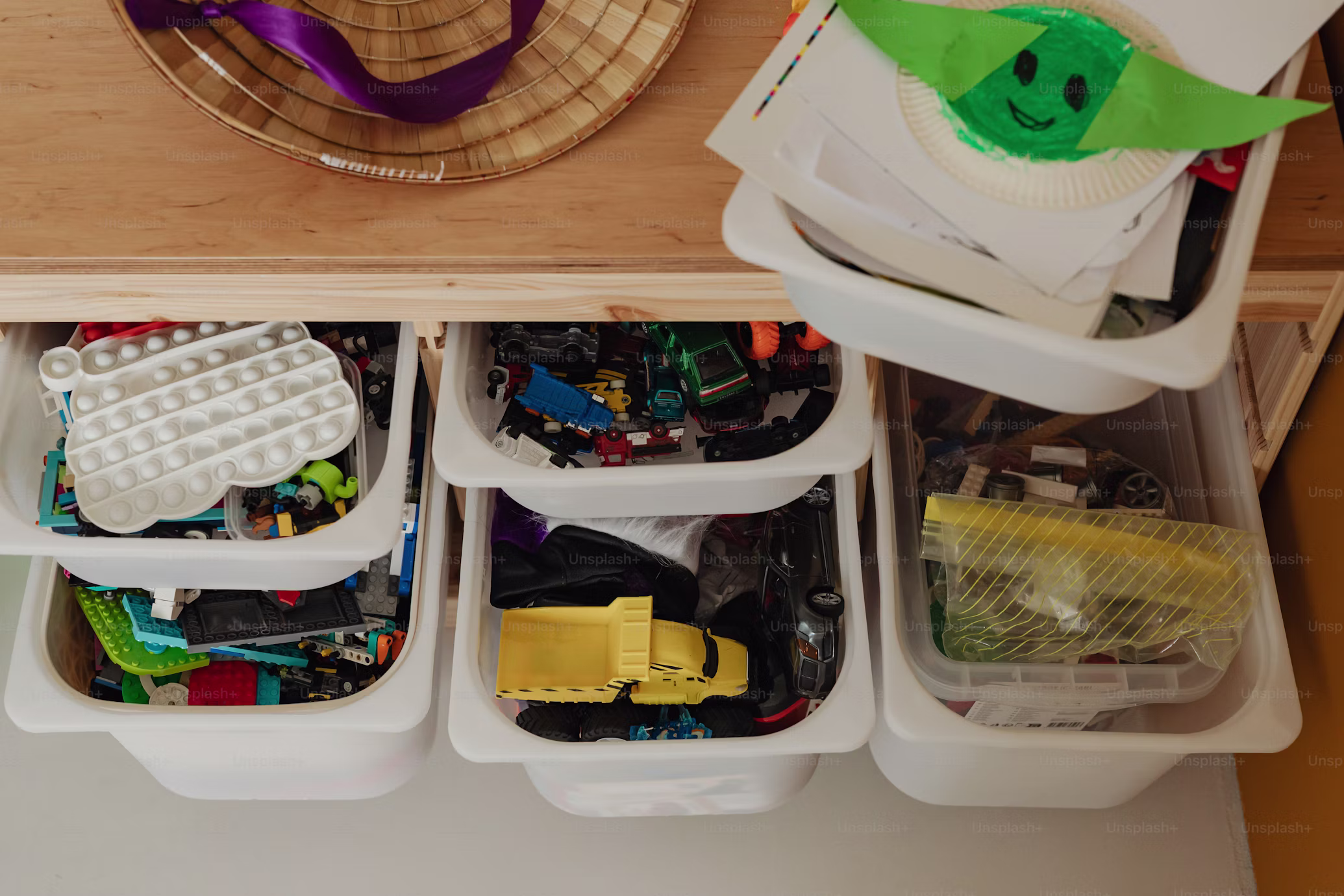 Toy bins sorted with LEGO, cars and blocks
